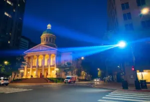 Nighttime police response at a city alley with law enforcement officers