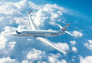Embraer jet soaring through the clouds