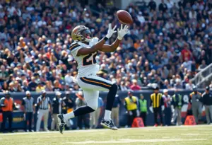 Wide receiver catching a football during a game