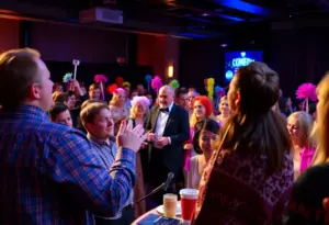 Audience participating in a live auction comedy at Candlelight Theatre, Bloomington
