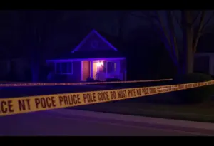Police tape surrounding a suburban home in Indianapolis