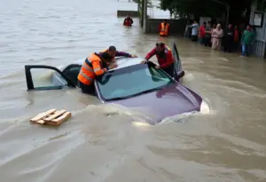 Rescue scene of a car submerged in floodwaters in Indianapolis.
