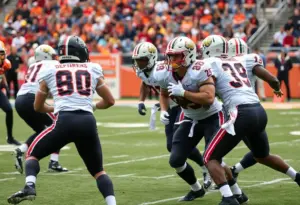 Defensive players collaborating on the football field during a game.
