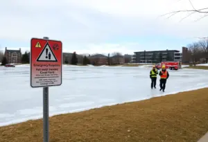 Emergency responders at Holcomb Gardens Pond during an ice rescue operation.