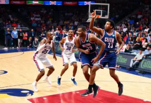 Intense NBA basketball game featuring two teams with exciting crowd interaction.
